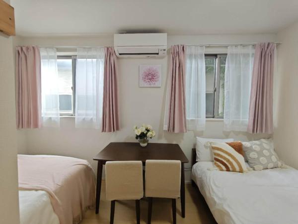 Nerima house : photo 6 de la chambre chambre double avec 2 lits doubles