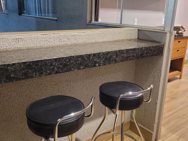 Califórnia Suítes : photo 7 de la chambre chambre lit queen-size - vue sur piscine