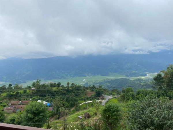 Dulcify cottage sarangkot : photo 10 de la chambre chambre lit queen-size avec balcon