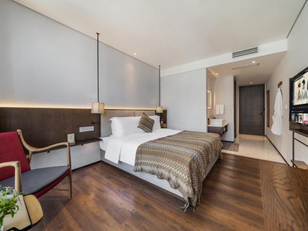 Wuyu Hotel - Chongqing Jiangbei Airport : photo 9 de la chambre chambre double deluxe avec baignoire