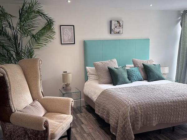 Beachcliff Rooms & Apartments : photo 10 de la chambre suite deluxe avec lit king-size