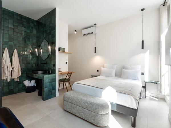 Mouchki : photo 2 de la chambre chambre double deluxe avec baignoire