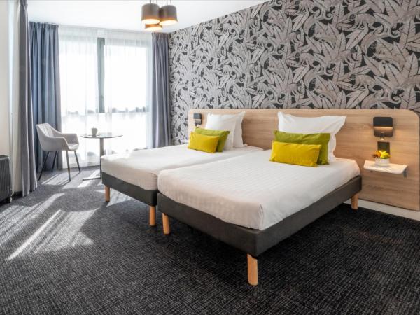 Nemea Appart Hotel Nice Arenas Aéroport : photo 2 de la chambre chambre lits jumeaux