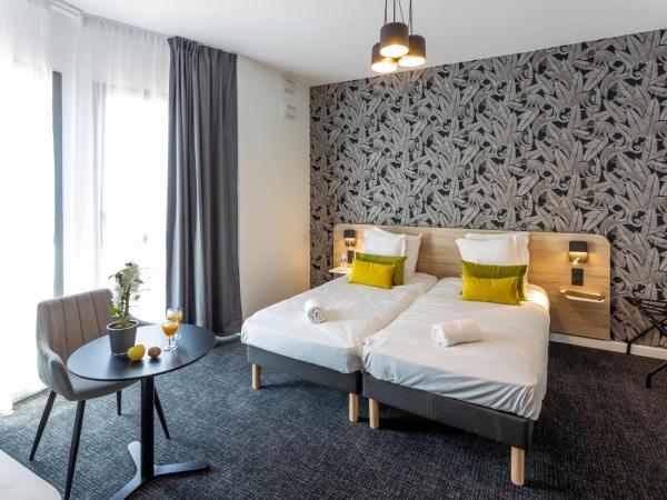 Nemea Appart Hotel Nice Arenas Aéroport : photo 1 de la chambre chambre lits jumeaux