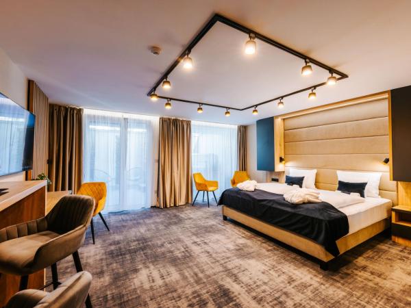 Hotel Auris : photo 3 de la chambre chambre lit king-size avec baignoire spa