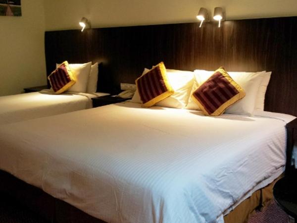 Hotel Grand Continental Kuantan : photo 1 de la chambre chambre triple premium
