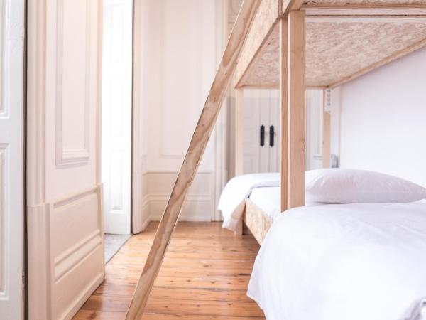 Porto Republica Hostel & Suites : photo 1 de la chambre chambre quadruple avec salle de bains commune