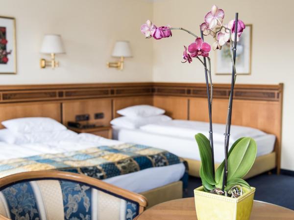 Hotel Mondschein : photo 6 de la chambre chambre triple deluxe