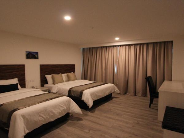 Molek Garden Hotel : photo 4 de la chambre chambre triple deluxe