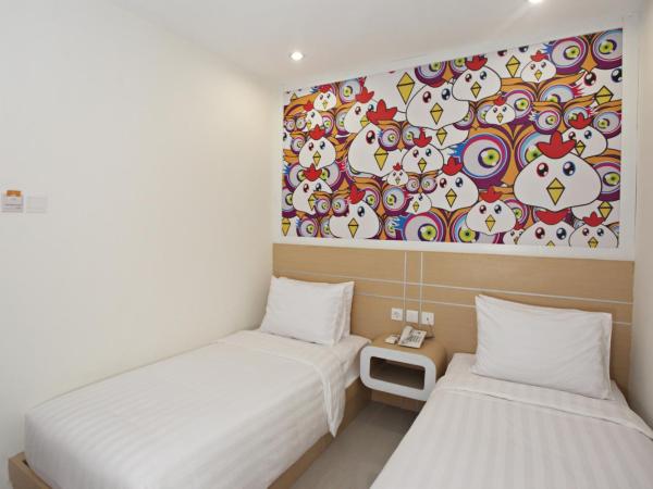 Nite & Day Surabaya - Gunungsari : photo 2 de la chambre chambre deluxe double ou lits jumeaux