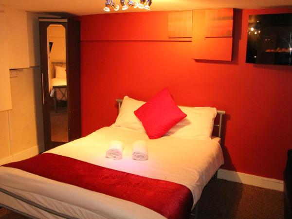 London Olympus Hotel Nirvana : photo 2 de la chambre chambre familiale avec salle de bains