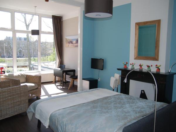 Bed & Breakfast Obrechtstraat : photo 1 de la chambre suite lit king-size
