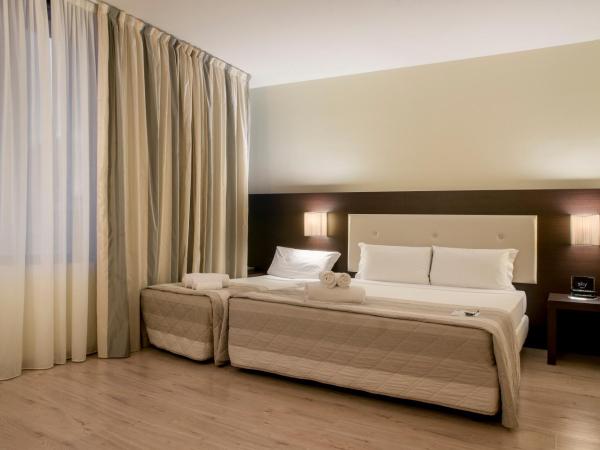 Hotel Executive : photo 3 de la chambre chambre triple standard