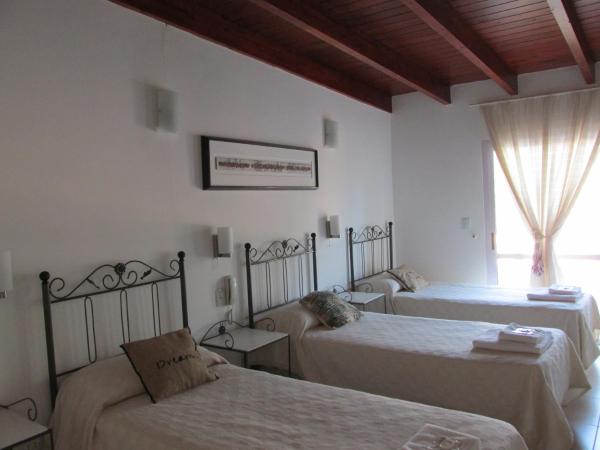 Faro del Parque : photo 3 de la chambre chambre quadruple