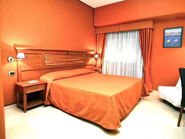 Hotel Futura Centro Congressi : photo 1 de la chambre chambre quadruple
