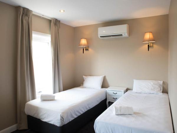 Lily Sands Inn : photo 1 de la chambre chambre lit king-size - accessible aux personnes à mobilité réduite