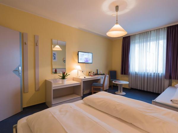 Tagungshotel Höchster Hof : photo 1 de la chambre chambre quadruple