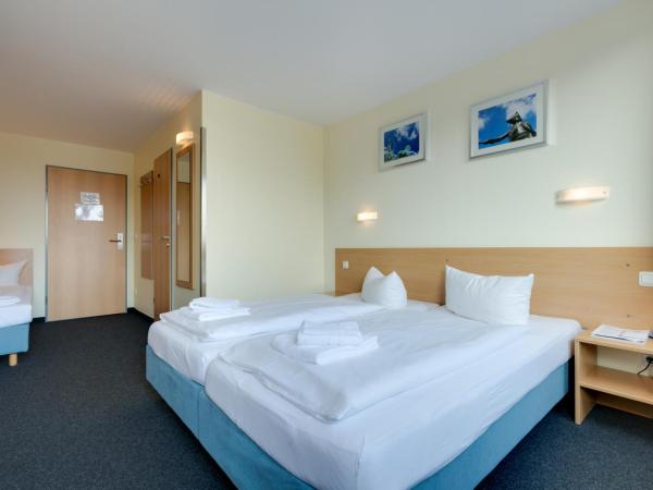 Familienhotel Citylight : photo 3 de la chambre chambre triple