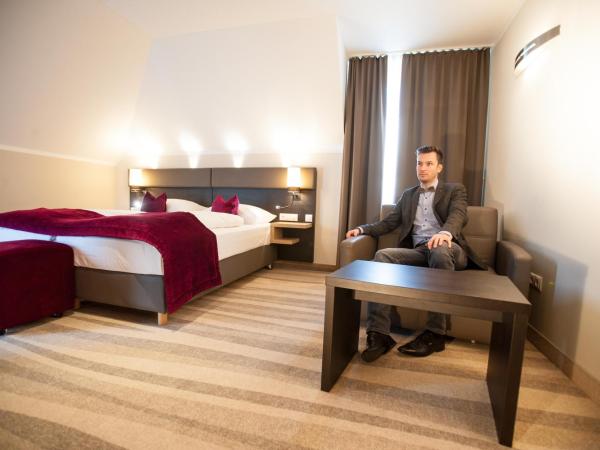 Amalienburg - Boutique & Boarding Hotel : photo 3 de la chambre chambre triple deluxe