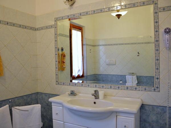 L'Acchiappasogni : photo 2 de la chambre chambre double ou lits jumeaux deluxe – vue sur jardin