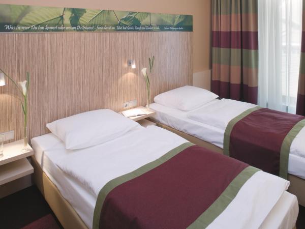 Mövenpick Hotel Frankfurt City Messe : photo 1 de la chambre chambre lits jumeaux classique