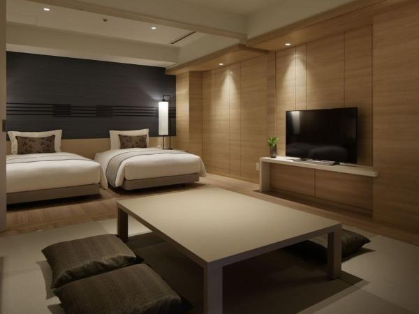 Kobe Minato Onsen Ren : photo 1 de la chambre deluxe twin room with tatami area and terrace - ocean view