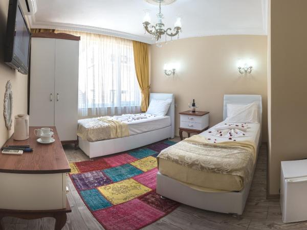 Ozmen Hotel : photo 1 de la chambre chambre deluxe double ou lits jumeaux