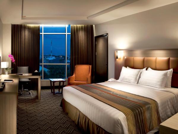 Cavinton Hotel Malioboro Yogyakarta by Tritama Hospitality : photo 2 de la chambre chambre deluxe double ou lits jumeaux