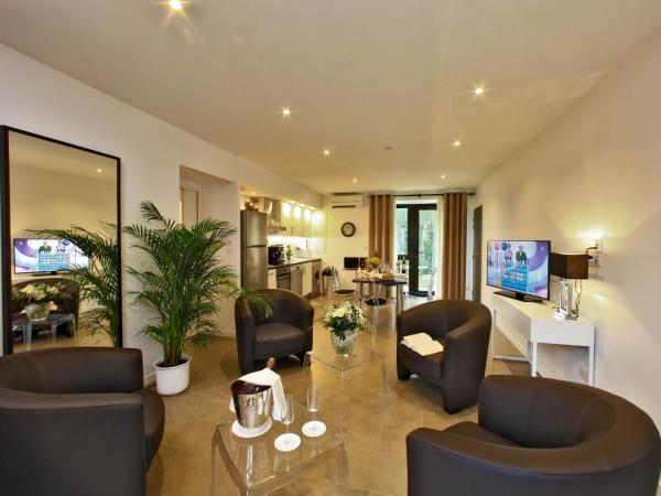 Les Jardins du Porche : photo 1 de la chambre appartement 2 chambres de luxe avec jardin privé