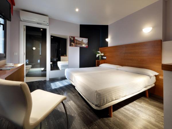 Exe Hotel El Magistral : photo 2 de la chambre chambre double ou lits jumeaux supérieure avec salon