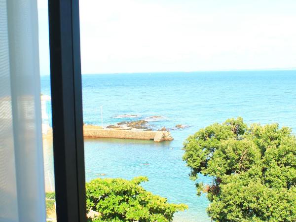 Hit Hotel : photo 4 de la chambre chambre quadruple standard avec vue sur la mer