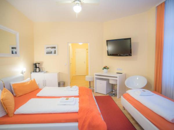 City Guesthouse Pension Berlin : photo 4 de la chambre suite 2 chambres