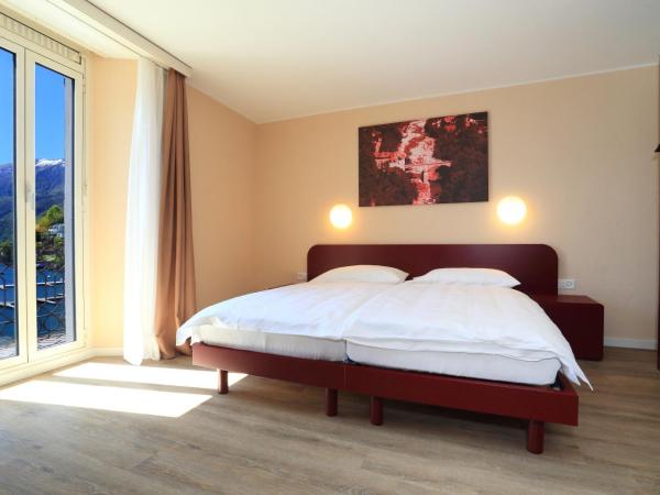 New Elvezia : photo 5 de la chambre chambre lits jumeaux avec balcon et vue sur le lac