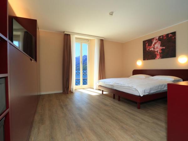 New Elvezia : photo 3 de la chambre chambre lits jumeaux avec balcon et vue sur le lac