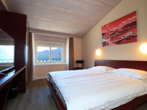 New Elvezia : photo 2 de la chambre chambre lits jumeaux - vue sur lac