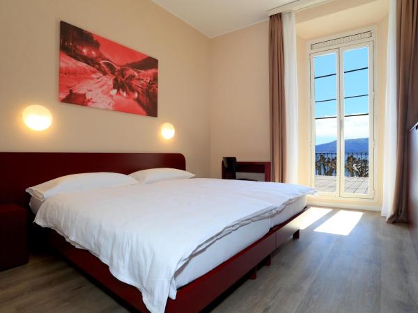 New Elvezia : photo 2 de la chambre chambre lits jumeaux avec balcon et vue sur le lac