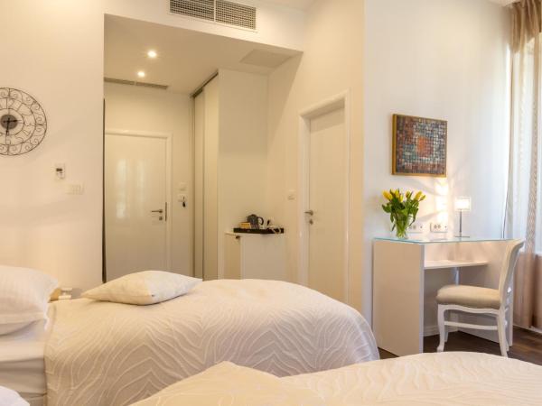 Pellegrini Luxury Rooms : photo 9 de la chambre chambre double ou lits jumeaux deluxe – vue sur jardin