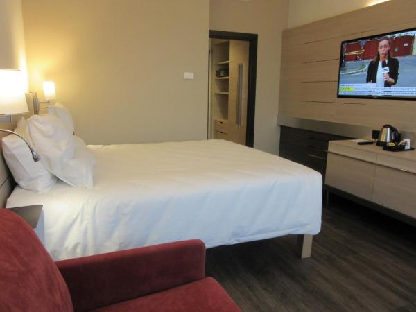 Novotel Brescia Due : photo 2 de la chambre chambre lit king-size supérieure avec canapé-lit