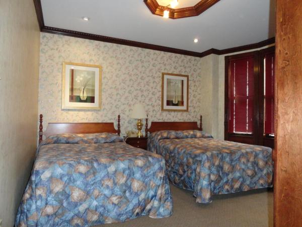 Hotel 31 Extended Stay : photo 4 de la chambre chambre double avec 2 lits doubles et salle de bains privative