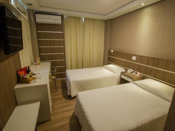 SJ Royal - San Juan Curitiba : photo 3 de la chambre chambre lits jumeaux deluxe