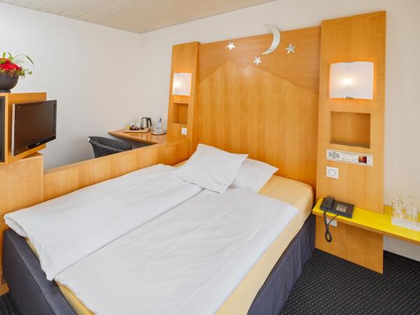 Stella Swiss Quality Hotel : photo 2 de la chambre chambre simple avec petit lit double