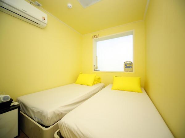 24 Guesthouse KyungHee University : photo 3 de la chambre chambre lits jumeaux