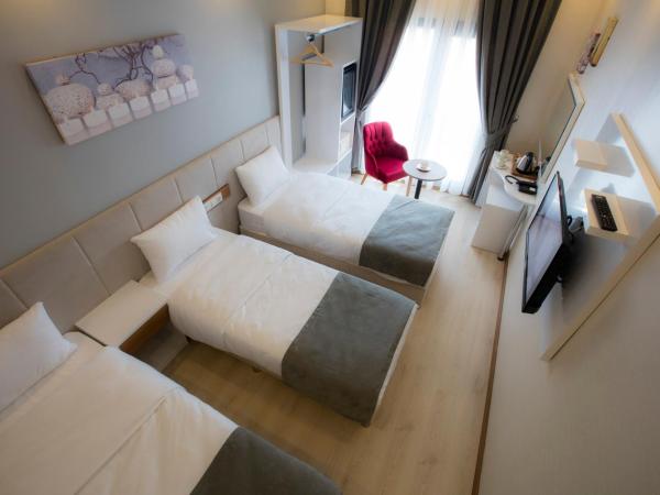 Royal İnci Hotel : photo 4 de la chambre chambre triple deluxe