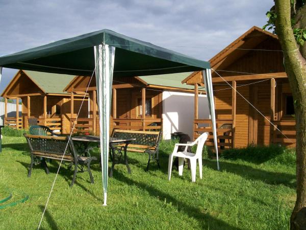 Camping domki letniskowe : photo 8 de la chambre cottage - vue sur jardin