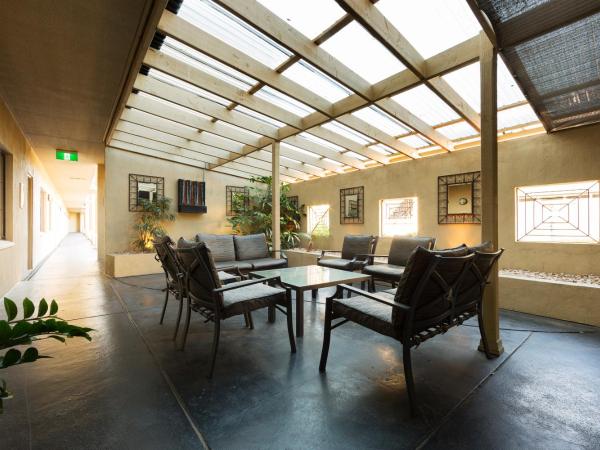 Canberra Parklands Central Apartment Hotel Official : photo 3 de la chambre suite lit queen-size