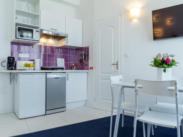 Nice Appart : photo 3 de la chambre studio familial – vue sur jardin (4 adultes)