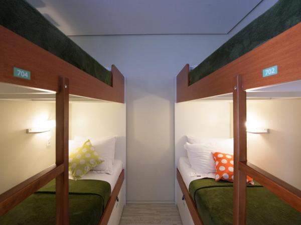 Brazilodge All Suites Hostel : photo 5 de la chambre lit simple dans dortoir pour femmes de 4 lits