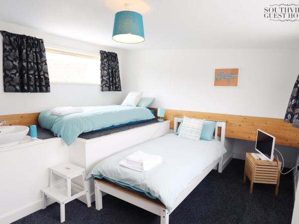 Southville Guest House : photo 9 de la chambre chambre lits jumeaux standard avec salle de bains commune