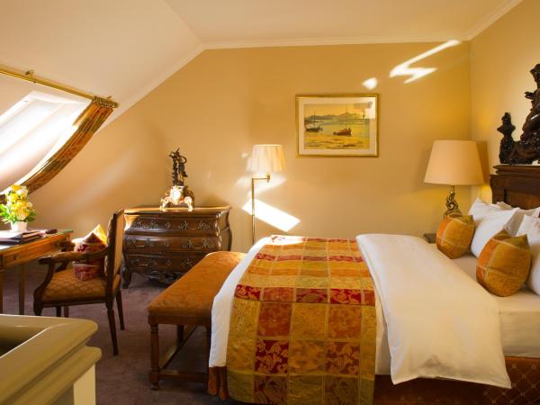 Hôtel de la Cigogne : photo 6 de la chambre suite en duplex avec lit queen-size
