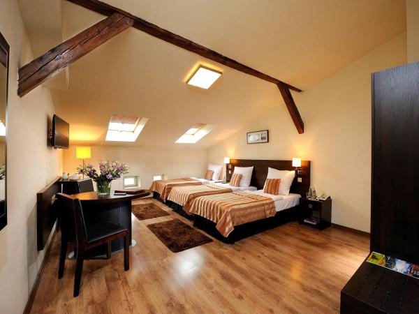 Spatz Aparthotel : photo 1 de la chambre chambre triple